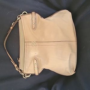 COACH bag.  Light Tan leather with silver buckles.  Blue lining
